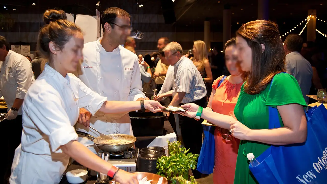 Close up on a plate of mashed potatoes, topped with baked pork chops with cream of mushroom soup, and a side of green beans.
