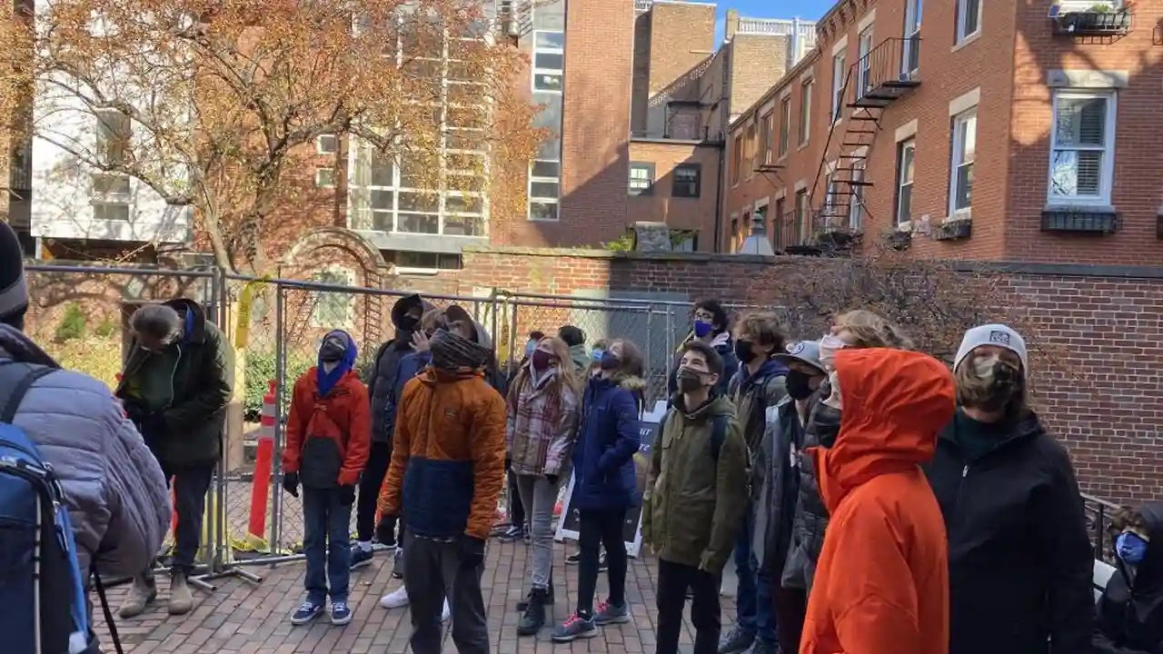 overhead view of corned beef sliced and on a platter with cabbage, potatoes, and carrots