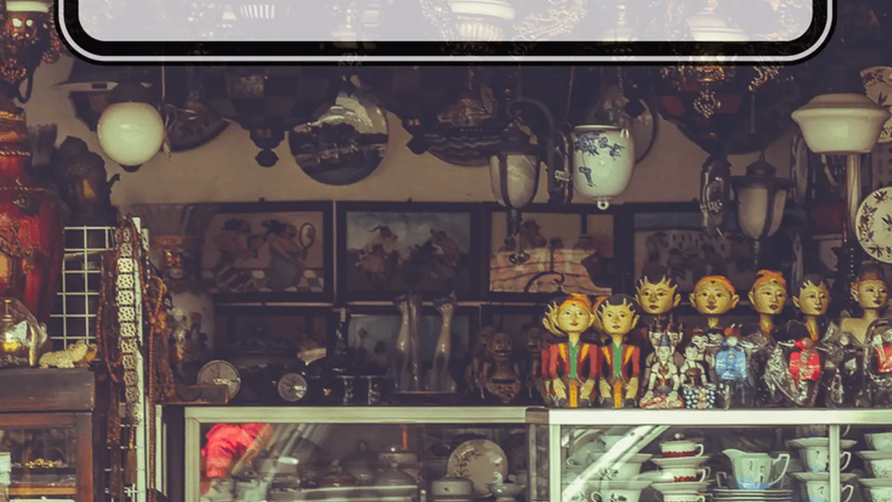 blue bowl of black bean beef tortilla soup on a board with cilantro and shredded cheese in background